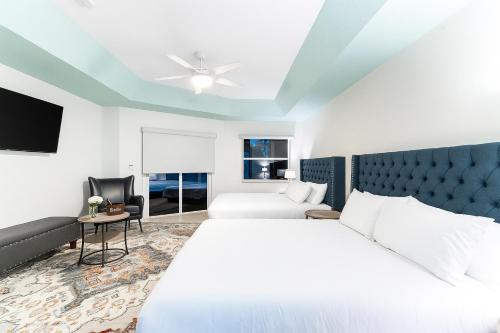 a hotel room with two beds and a tv at Large 5BR Home – Pool Table Yard Beaches in Delta