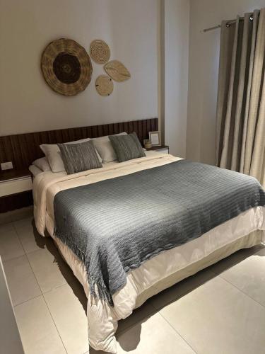 a bedroom with a large bed in a room at Vista al Rio by renty in Encarnación
