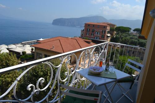a view from a balcony of a balcony overlooking a city at Al Centro Suites in Sorrento