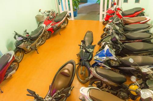 a group of motorcycles parked in a room at Thanh Tùng Hotel HCM in Ho Chi Minh City