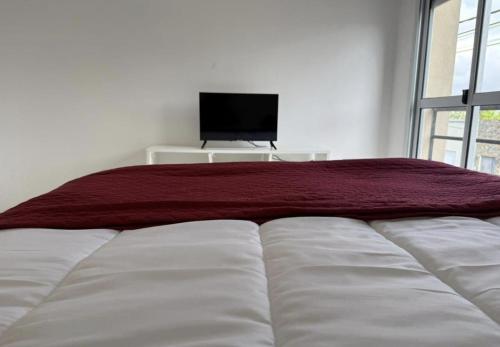 Postel nebo postele na pokoji v ubytování dpto GAMA a cuadras del corsodromo