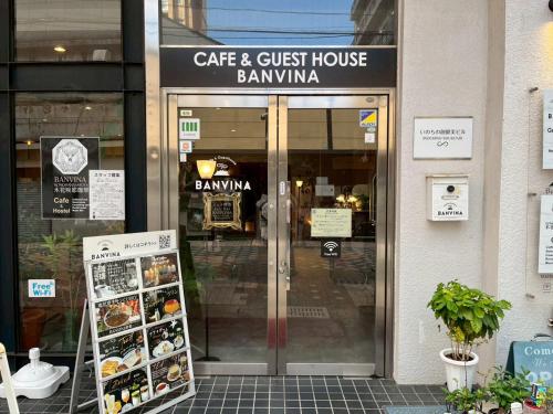 a cafe and guest house bakery in front of a store at Guesthouse Banvina in Kagoshima