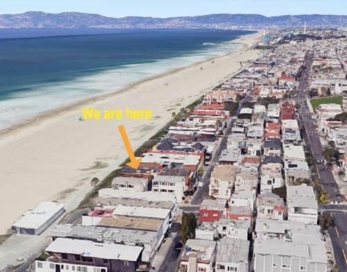 an aerial view of a beach with a yellow arrow at Stay on The Strand Manhattan Beach 4 bedroom in Manhattan Beach