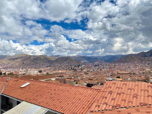 a view of a city with mountains in the background at Two-Story San Blas Home with Terrace and Stunning Views in Cusco