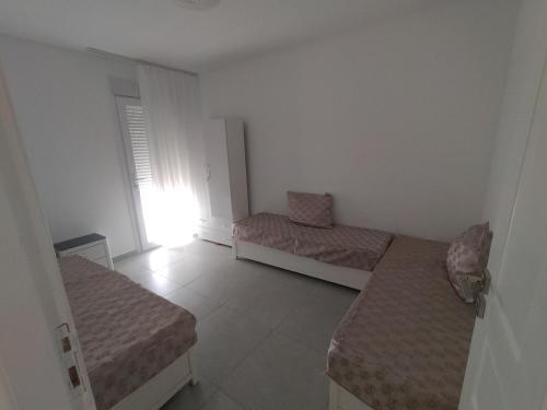 Ένα ή περισσότερα κρεβάτια σε δωμάτιο στο Pleasant apartment