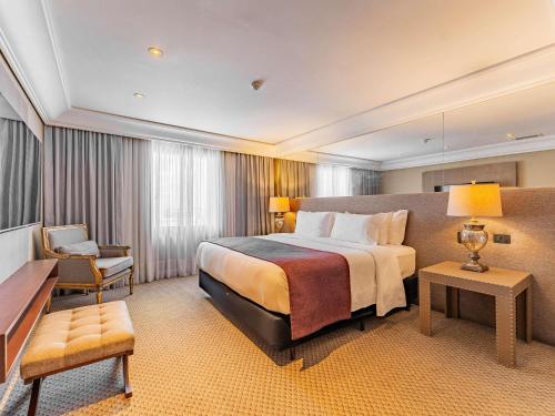 เตียงในห้องที่ Grand Mercure Curitiba Rayon