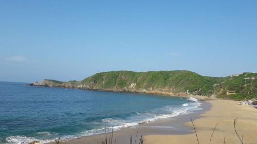 a view of a beach with the ocean at Posada Ziga Playa in Mazunte