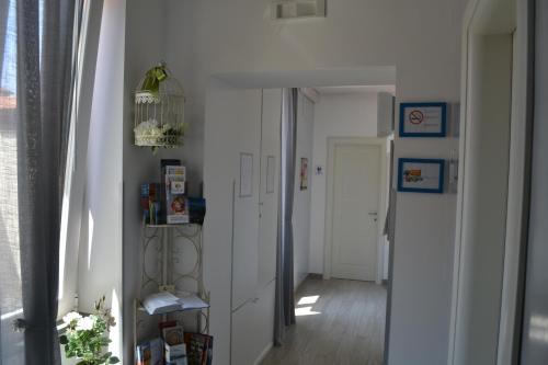 a room with a hallway with white walls and a door at Al Centro Suites in Sorrento