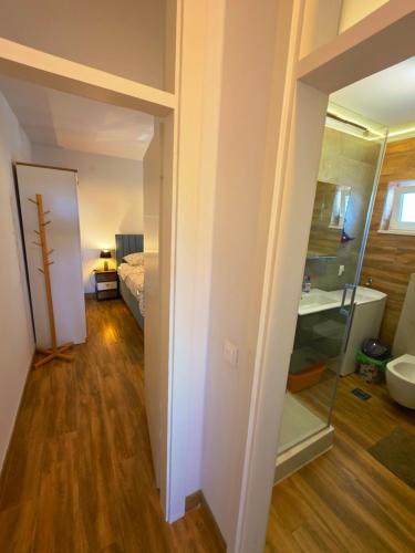 a room with a bed and a glass door at Villa Angela in Orebić