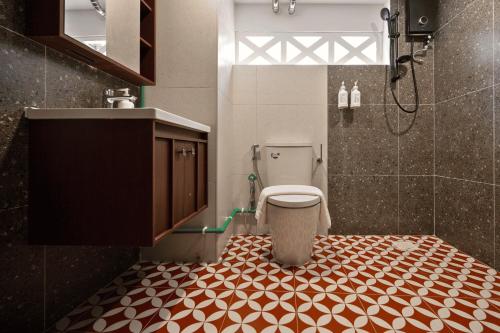 a bathroom with a shower and a toilet in it at Habyt Chinatown in Singapore