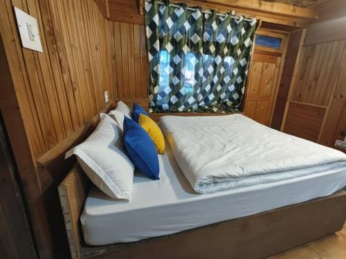 a bed in the back of a boat at Oran Stays Shoja in Shoja