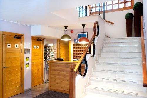 a kitchen with a staircase leading to a stairwell at Hotel Mila in Encamp