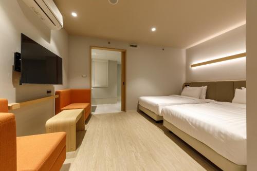 Ένα ή περισσότερα κρεβάτια σε δωμάτιο στο Nishitetsu Hotel Croom Bangkok Silom