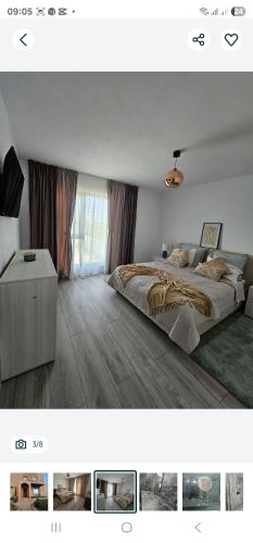 a bedroom with a large bed and a window at ZenHome in Craiova