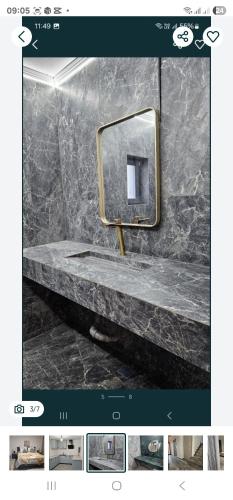 a bathroom with a sink and a mirror at ZenHome in Craiova