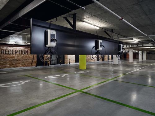 an empty parking lot with several toilets in a parking garage at Mövenpick Zagreb in Zagreb