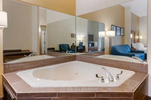 a large bath tub in a hotel room at Comfort Suites Lady Lake - The Villages in The Villages