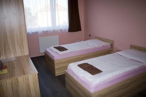 Postel nebo postele na pokoji v ubytování Penzión na Rožku