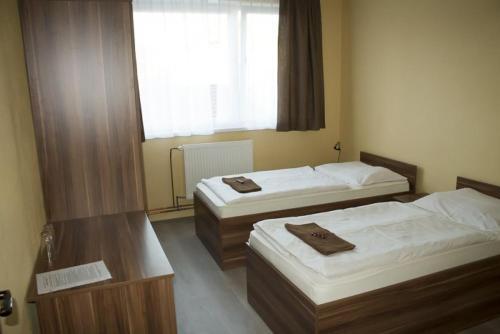 Postel nebo postele na pokoji v ubytování Penzión na Rožku