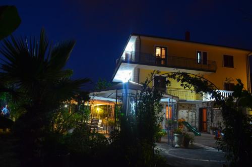 a large building with a light lit up at night at Villa Malandrino Guest House in Agropoli