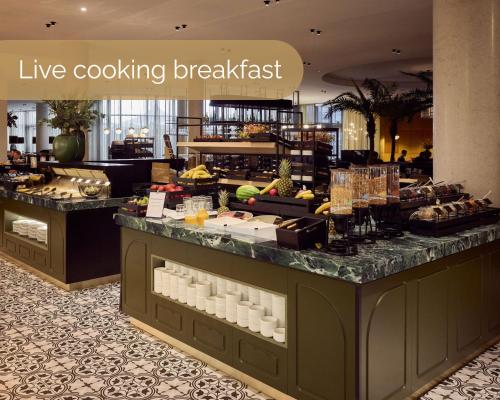 a store with a breakfast counter in a hotel at Van der Valk Hotel Gent in Ghent