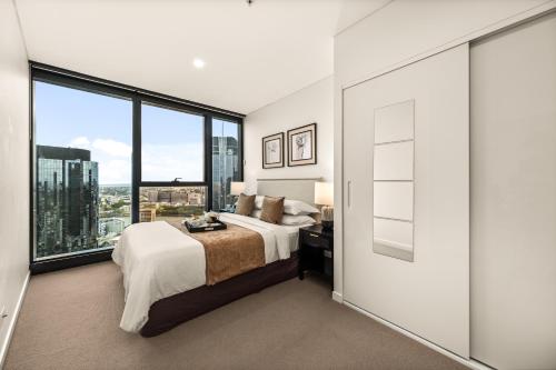 Ένα ή περισσότερα κρεβάτια σε δωμάτιο στο Brisbane luxe city living in the sky