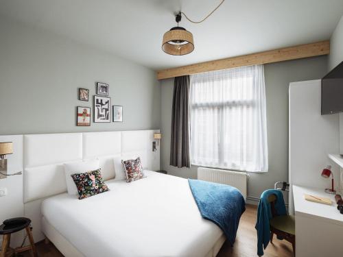 Postel nebo postele na pokoji v ubytování greet hotel Lille Gare Flandres - Groupe Accor