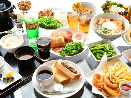a table topped with plates of food and drinks at Hotel Rose (Adult Only) in Gifu