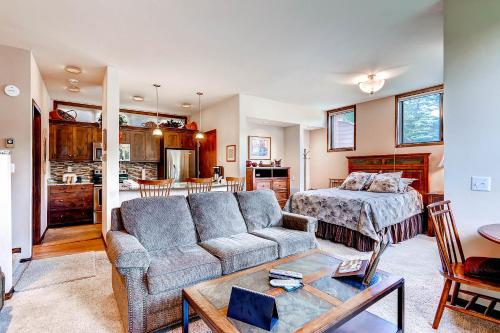 a living room with a couch and a bed at The Forest Neighborhood by Keystone Resort in Keystone