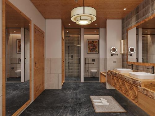 La salle de bains est pourvue de 2 lavabos et d'une douche à l'italienne. dans l'établissement Taj Gangtey Resort and Spa Bhutan, à Tshalunang