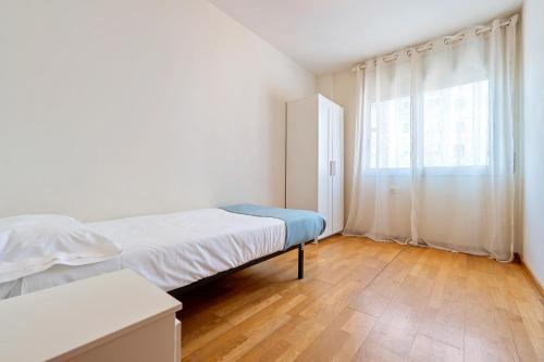 Ένα ή περισσότερα κρεβάτια σε δωμάτιο στο Clauhomes Reus Centro