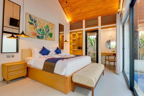 Ένα ή περισσότερα κρεβάτια σε δωμάτιο στο PROMO! 1BR Villa Orchid LaLuxe A10 Sanur
