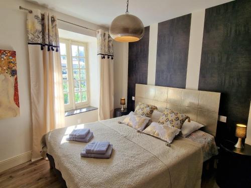 Postel nebo postele na pokoji v ubytování L'Orée de la cité