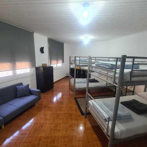 a living room with bunk beds and a couch at Villa Mallorquina tu zona para desconectar in Jacébanes