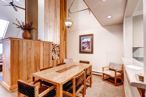 a dining room with a wooden table and chairs at Evergreen Condominiums by Keystone Resort in Keystone
