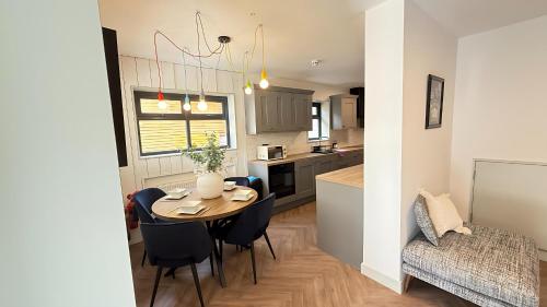 a kitchen and dining room with a table and chairs at Crystal Palace Stylish Large Ensuite Double Room in Crystal Palace