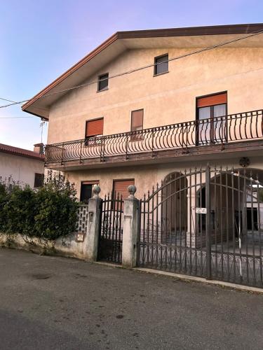 an old building with a fence in front of it at Monfalcone Easy Stay WEST in Monfalcone