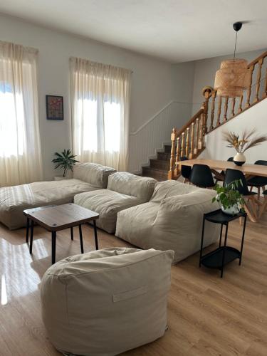 a living room with a couch and a table at Monfalcone Easy Stay WEST in Monfalcone