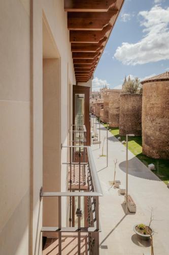 a view from the balcony of a building with metal stairs at FC Los Cubos Auto Check In in León