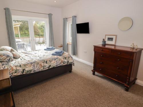 Postel nebo postele na pokoji v ubytování The Lodge