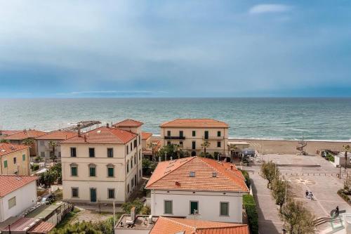 an aerial view of a town with the ocean at Hotiday Cecina Mare in Cecina