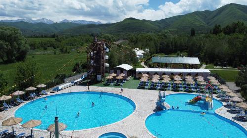 an aerial view of a resort with two pools at Aul Resort in Kaskelen