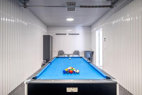 a pool room with a pool table in it at Sauna & Pool Table - Nordik Attitude in Saint-Philémon