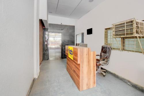 an office with a desk and a chair in a room at Via 24K Inn - Nr Manipal Hospital in Mundhwa