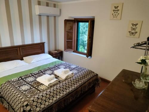 Postel nebo postele na pokoji v ubytování Villa MariaPia