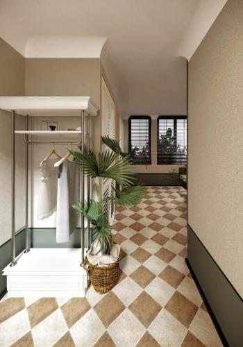 a hallway with a room with a plant in it at A Stay In Bàu Vá in Hue