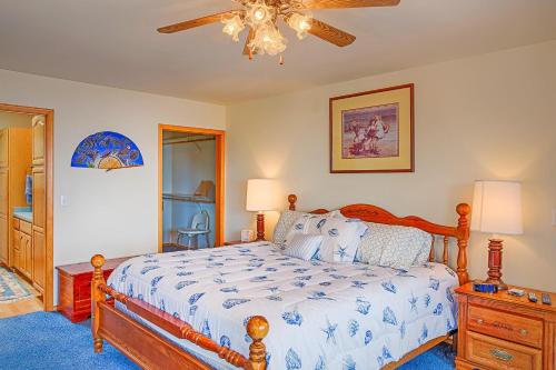 a bedroom with a bed and a ceiling fan at Sand Castle Bluff in Moclips