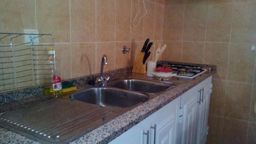 a kitchen with a sink and a counter top at Casa de Férias Morena Santa Cruz Madeira in Santa Cruz