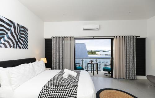 Coral Bay Apartment Wailoaloaにあるベッド