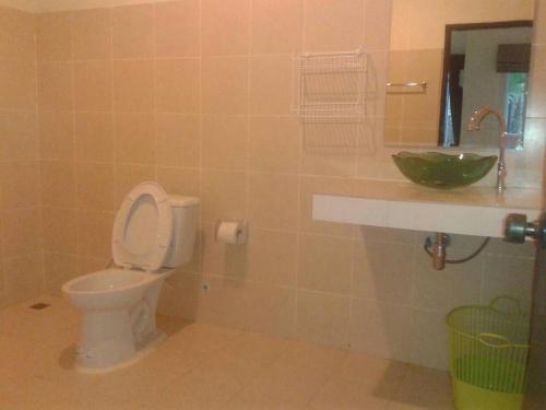 a bathroom with a toilet and a sink at Nakara Samui S2 One Bedroom Apt in Ban Thong Phlu